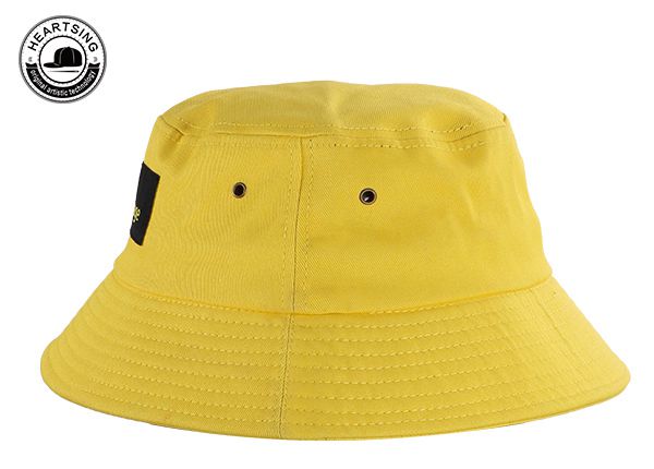 Боковая сторона изготовленной на заказ оранжевой хлопчатобумажной шляпы-ведерка